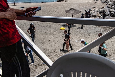 Migrants arrive after crossing from Morocco into the Spanish enclave of Ceuta, Thursday, July 30, 2026. 