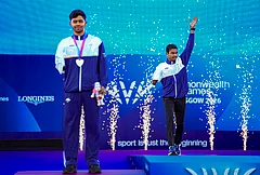 India's Dilip Mahadu Gavit, left, gold medallist, and Mohammed Basil Morssinganakath, silver medallist, pose with the national flag after finishing first and second in the Men's 100m T47 para-athletics event at the Commonwealth Games 2026, in Glasgow, Scotland, Thursday, July 30, 2026. - | Photo: PTI/Ravi Choudhary