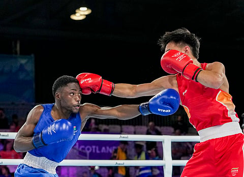 India's Jadumani Singh Mandengbam, red, and Namibia's Philip Pumulo Mutakela Haoseb in action during the Men's 55kg boxing semifinal at the Commonwealth Games 2026, in Glasgow, Scotland, Friday, July 31, 2026.
