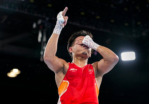 India's Jadumani Mandengbam celebrates after defeating Namibia's Philip Pumulo Mutakela Haoseb in the Men's 55kg boxing semifinal at the Commonwealth Games 2026, in Glasgow, Scotland, Friday, July 31, 2026. Jadumani won the bout 5-0 to advance to the final.