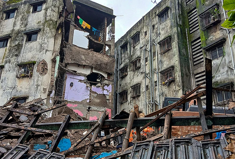 Damaged remains at the site after a portion of the Kohinoor Building in Balaji Nagar area of the powerloom town collapsed on late Thursday, in Bhiwandi, Maharashtra. - | Photo: PTI