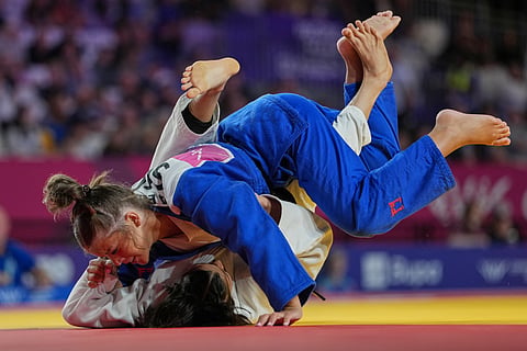 India's Asmita Dey, bottom, and Eva Ewing of Scotland compete in the women's judo 48kg quarter-final elimination, at the Commonwealth Games in Glasgow, Scotland, Friday, July 31, 2026.