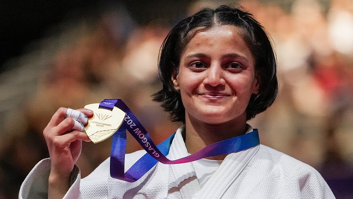 India's Asmita Dey poses with her gold medal during the victory ceremony for the Women's 48kg judo event at the Commonwealth Games 2026, in Glasgow, Scotland, Friday, July 31, 2026. Asmita became the first Indian judoka to win a Commonwealth Games gold medal. - (PTI Photo/Ravi Choudhary)