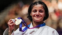 India's Asmita Dey poses with her gold medal during the victory ceremony for the Women's 48kg judo event at the Commonwealth Games 2026, in Glasgow, Scotland, Friday, July 31, 2026. Asmita became the first Indian judoka to win a Commonwealth Games gold medal. - (PTI Photo/Ravi Choudhary)