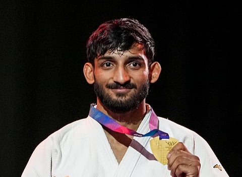 India's Harsh Singh poses for photographs during the presentation ceremony for the men's 60kg judo event at the 23rd Commonwealth Games, in Glasgow, Scotland, Friday, July 31, 2026. He won a historic gold at the CWG as he became the first male judoka from the country to win the title, pulling off a win over Australia's vastly experienced Katz in the final on Friday.