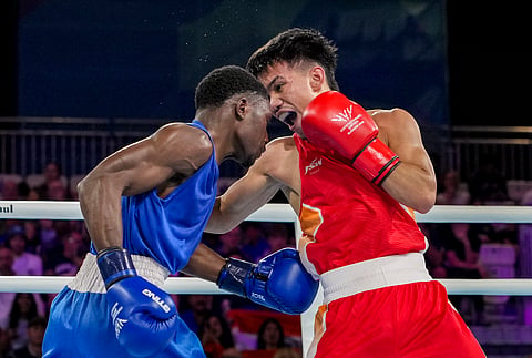 India's Jadumani Singh Mandengbam, red, and Namibia's Philip Pumulo Mutakela Haoseb in action during the Men's 55kg boxing semifinal at the Commonwealth Games 2026, in Glasgow, Scotland, Friday, July 31, 2026.