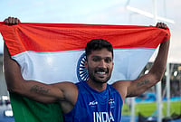| Photo: PTI/Ravi Choudhary : India's Tejaswin Shankar celebrates with the national flag after winning the bronze medal in the men's decathlon event at the Commonwealth Games 2026, in Glasgow, Scotland, Friday, July 31, 2026. Shankar amassed 7,976 points to become the first Indian athlete to win a Commonwealth Games medal in the decathlon. 