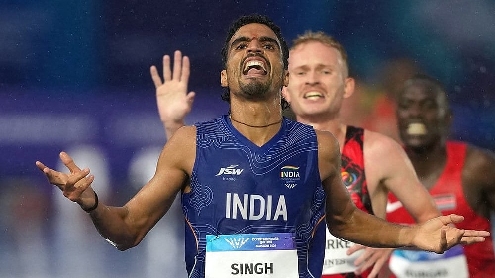 Gulveer Singh, of India, crosses the finish line to win the silver medal in the men's 10,000 meters final at the Commonwealth Games in Glasgow, Scotland, Tuesday, July 28, 2026.  - | Photo: AP/Eranga Jayawardena