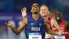 Gulveer Singh, of India, crosses the finish line to win the silver medal in the men's 10,000 meters final at the Commonwealth Games in Glasgow, Scotland, Tuesday, July 28, 2026. - | Photo: AP/Eranga Jayawardena