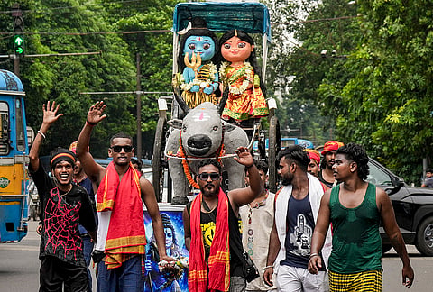 'Kanwariyas' take out a 'Kanwar Yatra' procession with idols of Lord Shiva and Goddess Parvati during the holy month of 'Sawan', in Kolkata, West Bengal.
