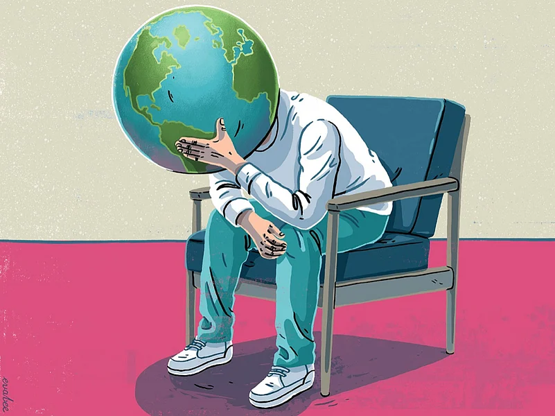 An illustration of a person with the Earth as a head, sitting in a chair crying into their hands