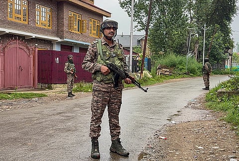 Security personnel conduct a cordon-and-search operation after two labourers from Chhattisgarh were killed in a terrorist attack at a brick kiln, in Kulgam district, Jammu and Kashmir, Saturday, Aug. 1, 2026. 