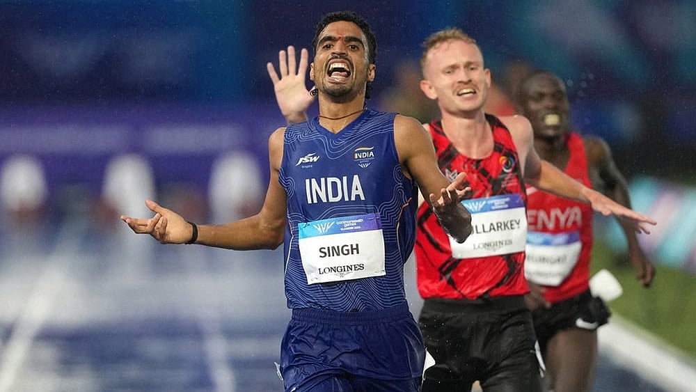 Gulveer Singh, of India, crosses the finish line to win the silver medal in the men's 10,000 meters final at the Commonwealth Games in Glasgow, Scotland, Tuesday, July 28, 2026.  - | Photo: AP/Eranga Jayawardena