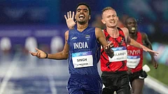 Gulveer Singh, of India, crosses the finish line to win the silver medal in the men's 10,000 meters final at the Commonwealth Games in Glasgow, Scotland, Tuesday, July 28, 2026. - | Photo: AP/Eranga Jayawardena