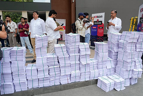 Bundles of signed petitions are seen outside the Constitution Club during the 'National Town Hall Against E20', in New Delhi.