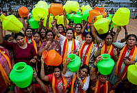 | Photo: PTI : Members of Karnataka Rakshana Vedike (KRV) women's wing holding empty pots raise slogans and stage a protest against the Cauvery Water Regulation Committee (CWRC) over the directive to release Cauvery water to Tamil Nadu, in Bengaluru, Saturday, Aug. 1, 2026. 