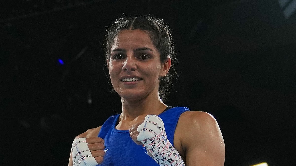 India's Sakshi Chaudhary celebrates after winning her bout with Northern Ireland's Caitlin Fryers in the women's 51kg quarterfinal at the Commonwealth Games in Glasgow, Scotland, Wednesday, July 29, 2026. - (AP Photo/Eranga Jayawardena)