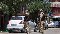 | Photo: PTI : Security personnel keep a vigil during an inspection of vehicles to maintain public safety 