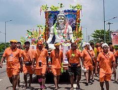 Kanwariyas' take out a 'Kanwar Yatra' procession with an idol of Lord Shiva during the holy month of 'Sawan' - | Photo: PTI