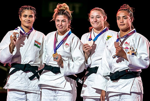 India’s Yamini Mourya, left, with England’s Acelya Toprak, second left, and Lele Nairne, right, and South Africa’s Donné Breytenbach, second right, after the women's judo -57 kg category at the Commonwealth Games, in Glasgow, Scotland, Saturday, Aug. 1, 2026. Toprak clinches the gold medal, Mourya clinches the silver and Breytenbach and Nairne win the bronze medals in this event. 
