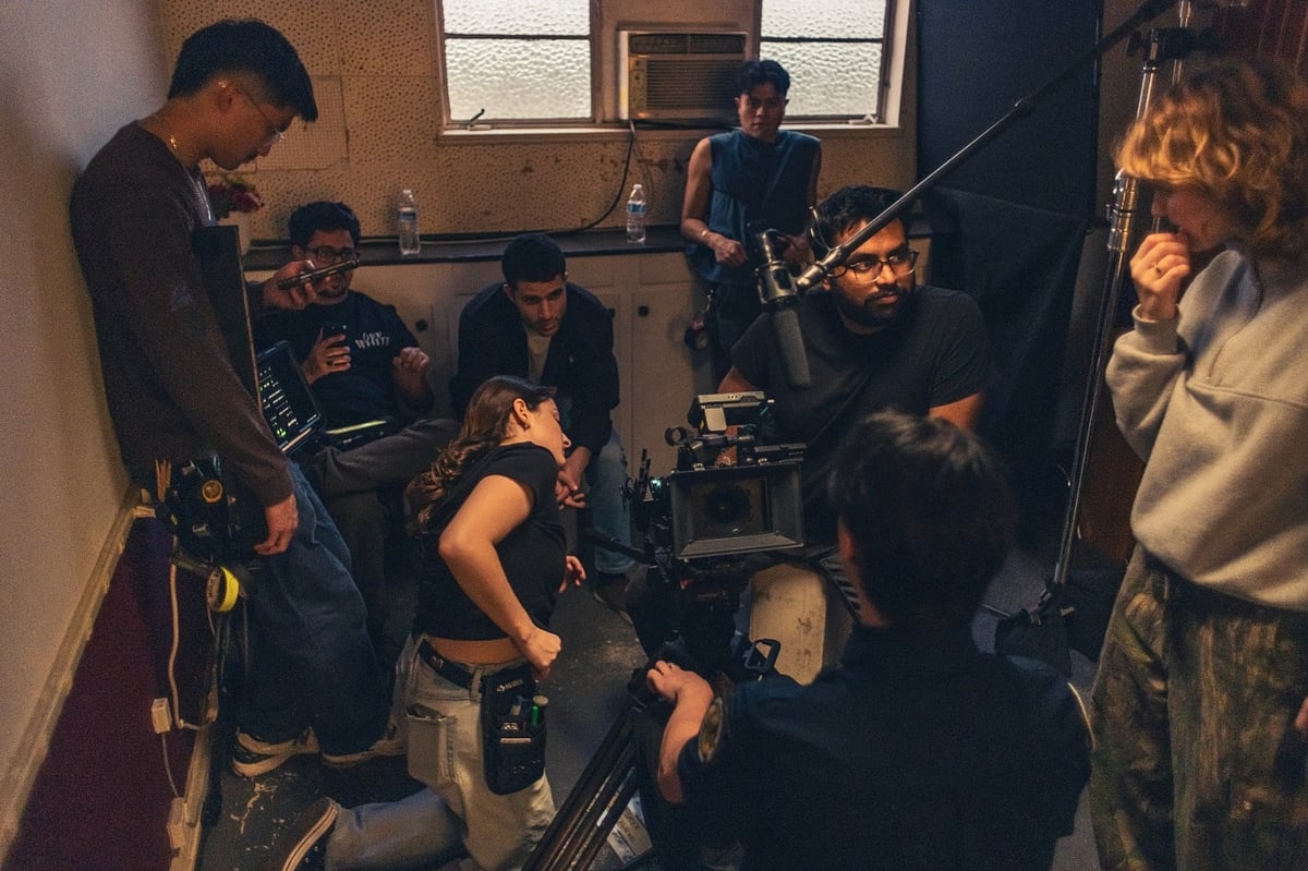 Himank Agarwal operating camera with film crew on set