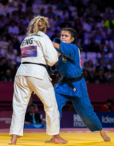 India’s Yamini Mourya competes against England’s Acelya Toprak during the women's judo -57 kg category at the Commonwealth Games, in Glasgow, Scotland, Saturday, Aug. 1, 2026. Toprak wins the gold medal and Mourya wins the silver in this event. 