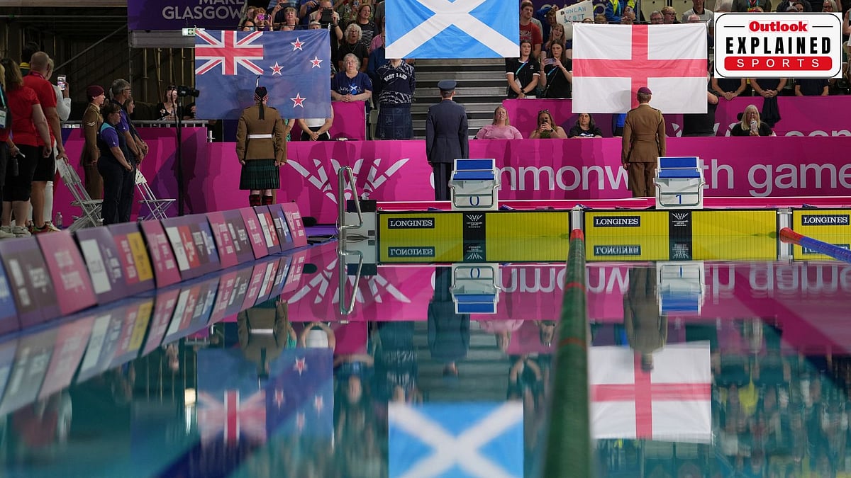 National flags are raised during the medal ceremony for the men's 200 meter individual medley swimming event with Duncan Scott of Scotland winning the gold medal during the Commonwealth Games in Glasgow, Scotland, Friday, July 24, 2026
 - (AP Photo/Kin Cheung)