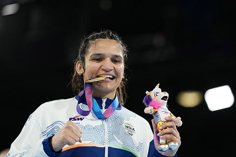 India's Arundhati Choudhary celebrates after winning the women's 70kg boxing final at the Commonwealth Games in Glasgow, Scotland.