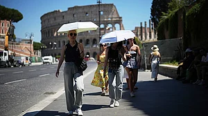 | Photo: AP/Andrew Medichini : Italy has placed 23 of its 27 major cities under a maximum red heat alert for Sunday