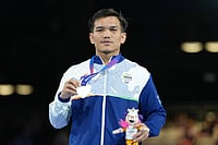 | Photo: AP/Eranga Jayawardena : Silver medalist India's Jadumani Singh Mandengbam celebrates after winning the men's 55kg boxing final at the Commonwealth Games in Glasgow, Scotland.