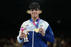 India's Priya Ghanghas celebrates after winning the women's 60kg boxing final at the Commonwealth Games in Glasgow, Scotland. - | Photo: AP/Eranga Jayawardena