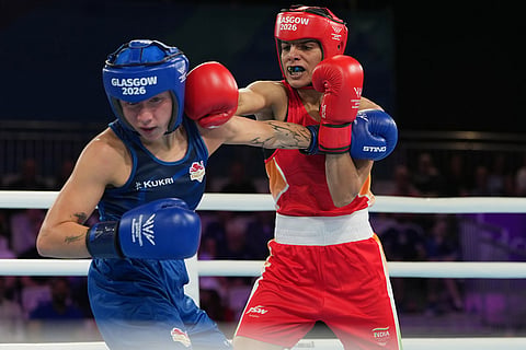 England's Ruby White, left, is punched by India's Sakshi Chaudhary during the women's 51kg boxing final at the Commonwealth Games in Glasgow, Scotland.