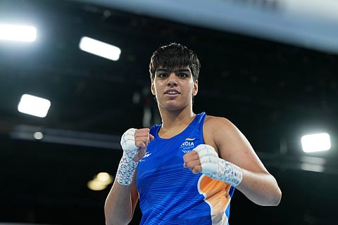 India's Priya Ghanghas celebrates after winning the women's 60kg boxing final at the Commonwealth Games in Glasgow, Scotland.