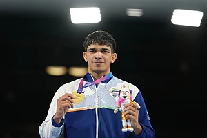 | Photo: AP/Eranga Jayawardena : India's Ankush Ankush celebrates after winning the men's 80kg boxing final at the Commonwealth Games in Glasgow, Scotland.