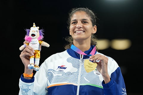India's Jaismine Jaismine celebrates after winning the women's 57kg boxing final at the Commonwealth Games in Glasgow, Scotland.