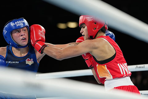 England's Ruby White, left, is punched by India's Sakshi Chaudhary during the women's 51kg boxing final at the Commonwealth Games in Glasgow, Scotland.