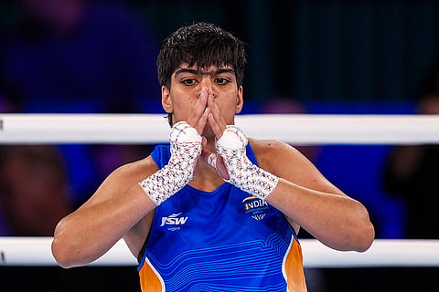 India's Priya Ghanghas celebrates after winning the final of the women's 60kg boxing event at the 23rd Commonwealth Games (CWG), in Glasgow, Scotland. Chaudhary bagged the gold medal in the event.