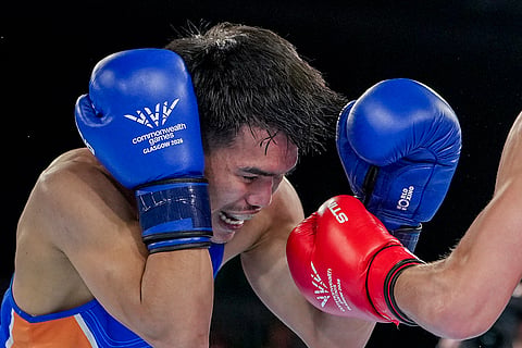 India's Jadumani Singh competes against Australia's Jye Dixon during the men's 55kg boxing final at the Commonwealth Games 2026, in Glasgow, Scotland. Singh bagged a silver medal.