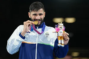 | Photo: AP/Eranga Jayawardena : India's Sachin Sachin celebrates after winning the men's 60kg boxing final at the Commonwealth Games in Glasgow, Scotland.