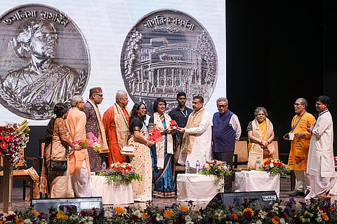West Bengal Chief Minister Suvendu Adhikari felicitates exiled Bangladeshi author Taslima Nasrin during a cultural programme organised to mark Nasrin's return to the city after nearly two decades, at Rabindra Sadan, in Kolkata, West Bengal. West Bengal Minister Swapan Dasgupta is also seen.