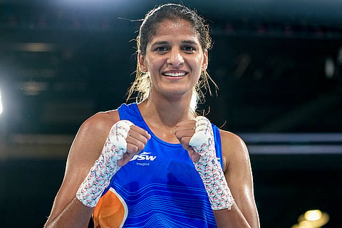India's Jaismine Lamboria, in blue, reacts after winning against Northern Ireland's Michaela Walsh during the Women's 57kg boxing final at the Commonwealth Games 2026, in Glasgow, Scotland. Lamboria won the gold medal. 