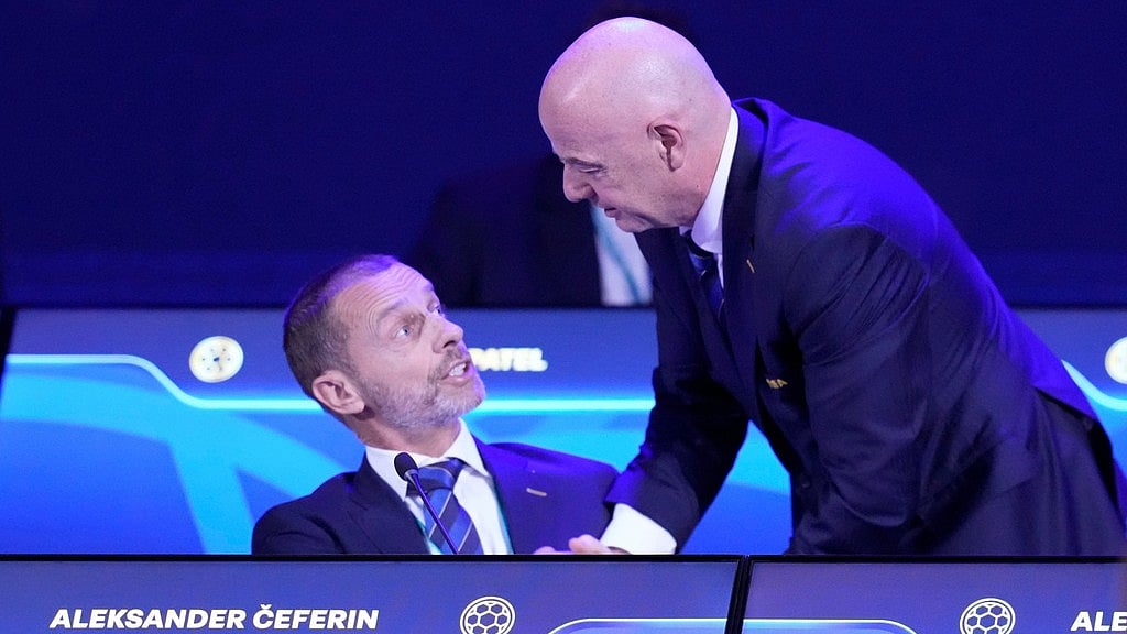FIFA President Gianni Infantino, right, talks to UEFA President Aleksander Ceferin during the FIFA 75th Congress at the Conmebol Convention Center in Luque. - AP Photo/Fernando Calistro, File