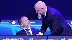 FIFA President Gianni Infantino, right, talks to UEFA President Aleksander Ceferin during the FIFA 75th Congress at the Conmebol Convention Center in Luque. - AP Photo/Fernando Calistro, File