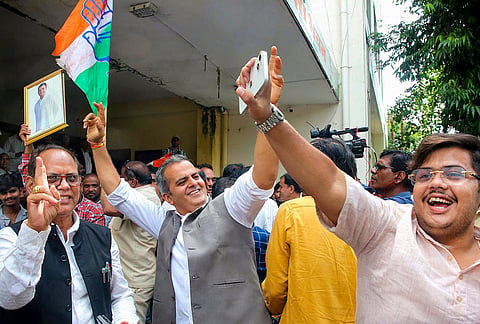 Congress workers celebrate the party's victory in the Datia Assembly by-election at the Pradesh Congress Committee (PCC) headquarters, in Bhopal. Congress candidate Ghanshyam Singh defeated BJP's Ashutosh Tiwari in the bypoll. 