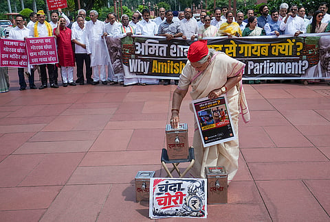 Samajwadi Party MP Jaya Bachchan stages a protest over alleged embezzlement of devotees' offerings at the Shri Ram Janmabhoomi Temple in Ayodhya, during the Monsoon session of Parliament, in New Delhi.