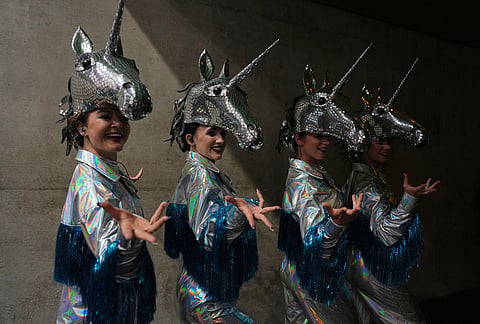 Performers wearing unicorn headdresses take part in the closing ceremony for Commonwealth Games in Glasgow, Scotland, Sunday, Aug. 2, 2026. 