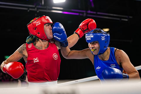 India's Lovlina Borgohain, in blue, competes against Australia's Emma-Sue Greentree in the women's 75kg final boxing bout at the 23rd Commonwealth Games (CWG), in Glasgow, Scotland.