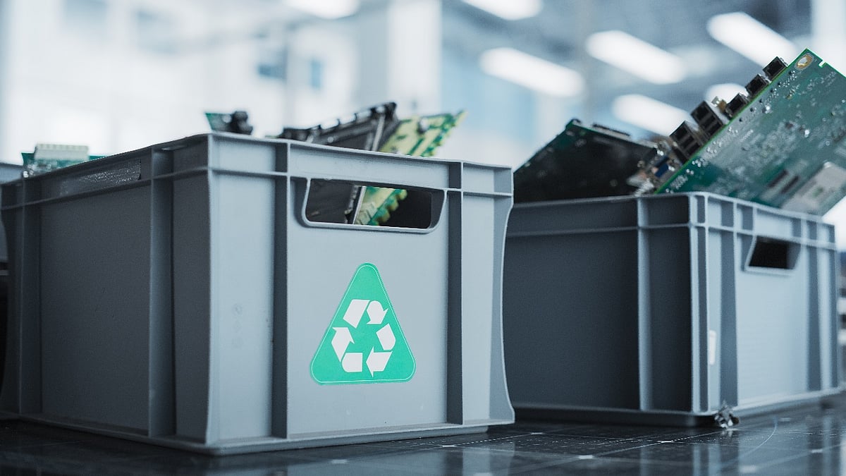 Electronic waste in gray recycling bins