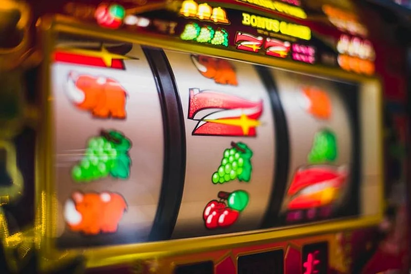A close-up shot of a brightly lit slot machine screen
