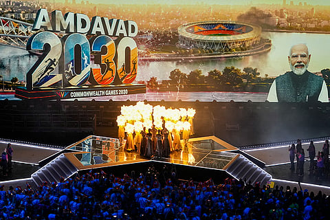 A portrait of Prime Minister Narendra Modi is projected on the screen as artistes perform during the closing ceremony of the 23rd Commonwealth Games (CWG), at OVO Hydro, in Glasgow, Scotland. The 2030 Games will be held in Ahmedabad, and the Scotland officials handed over the CWG flag and baton to Indian representatives -- Olympic gold medallist Neeraj Chopra, IOA president PT Usha and Gujarat Deputy Chief Minister Harsh Sanghavi.